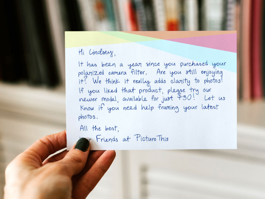 Image of a handwritten thank you note from a company, asking if the customer is still happy about their purchase and encouraging them to try their new product.